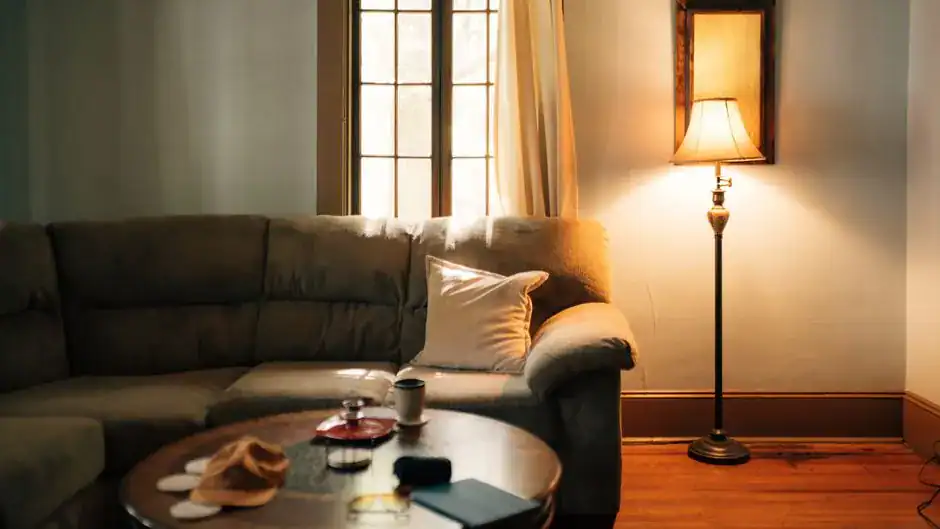 A cozy living room glowing with warm lamp light