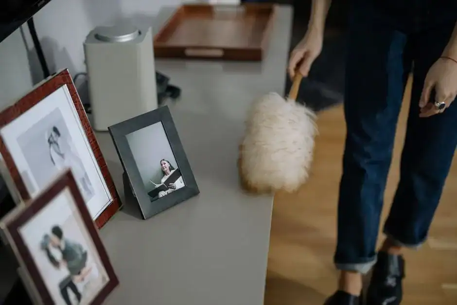 Framed family photos displayed on a shelf