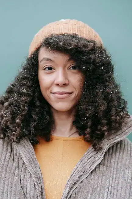 A young woman with a warm, friendly smile