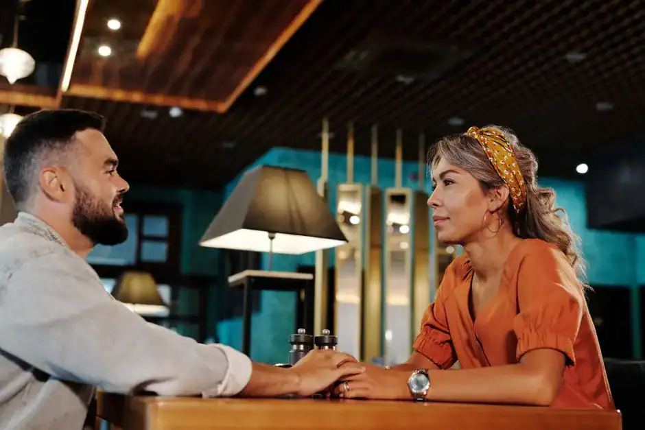 A couple in lively conversation at dinner