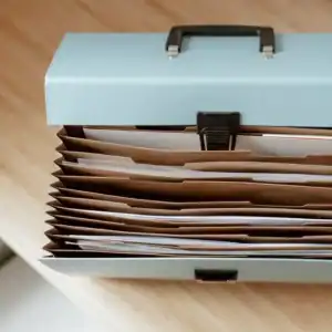 Paperwork sorted neatly into a file box with hanging folders