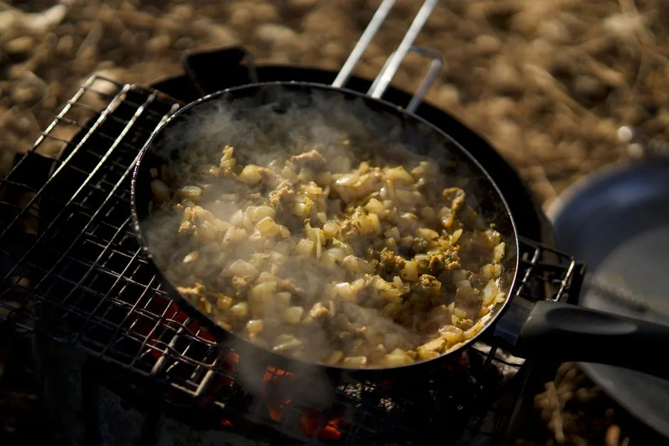 Onions cooking slowly in a skillet