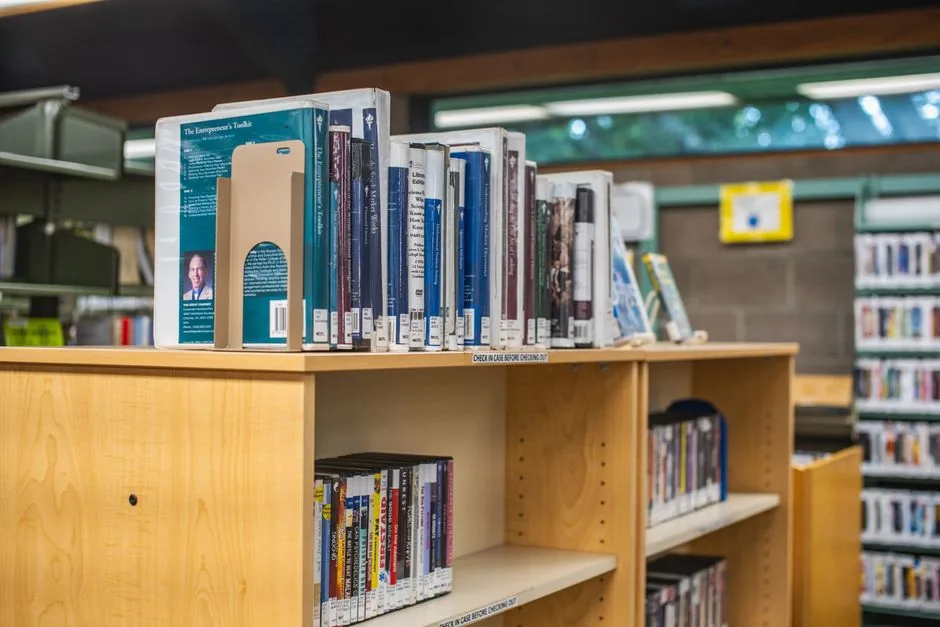 Rows of books on the shelves at a public library
