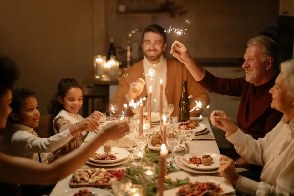 A family of all ages gathered around the dinner table together