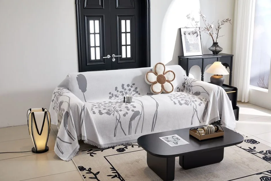 A soft throw blanket draped over a sofa