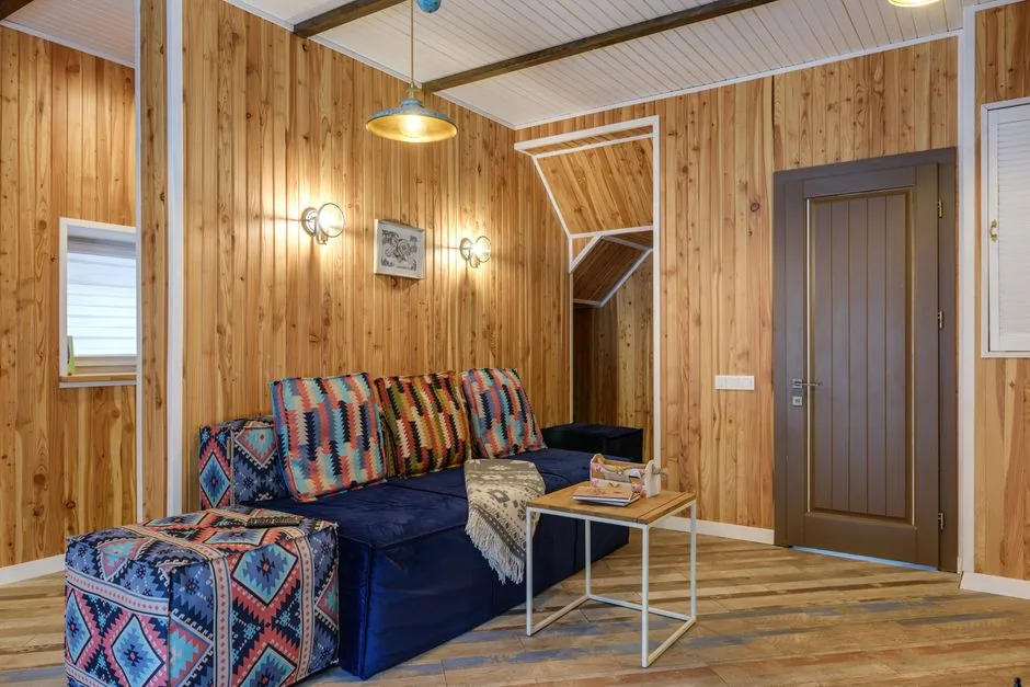 A room with knotty wood paneling covering the walls