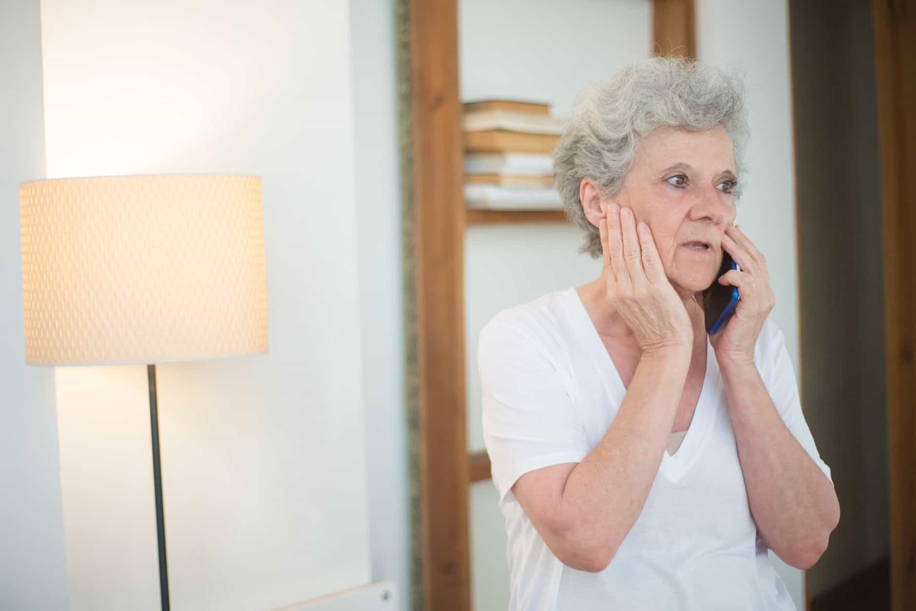 Grandmother talking on the phone at home